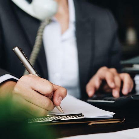 Business Woman Using Calculator — Hot Springs, AR — Malone Tax & Bookkeeping Business Woman Using Calculator — Hot Springs, AR — Malone Tax & Bookkeeping