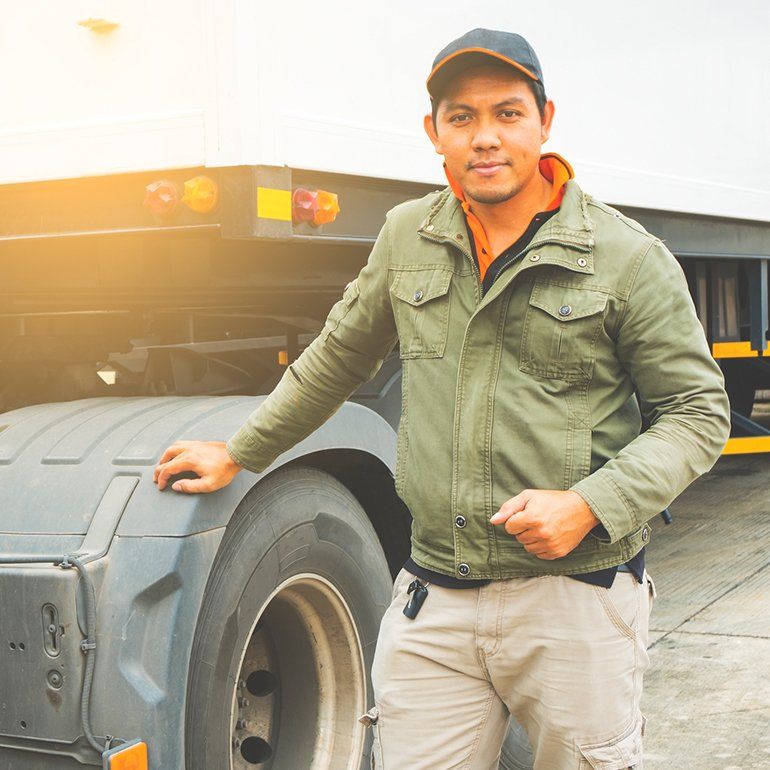 Truck Driver With Semi Truck Trailer — Hot Springs, AR — Malone Tax & Bookkeeping Truck Driver With Semi Truck Trailer — Hot Springs, AR — Malone Tax & Bookkeeping