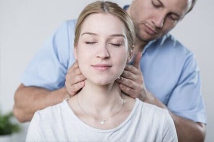 Woman having her neck massaged - Chiropractic in Sioux Falls, SD Woman having her neck massaged - Chiropractic in Sioux Falls, SD