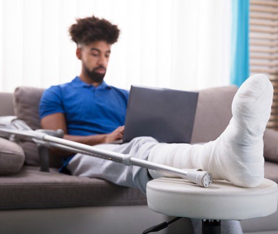 A Patient Using A Laptop | Hampden Medical Group | Englewood, Colorado