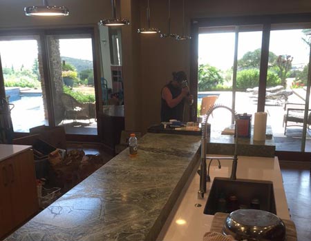 Man Installing Marble Countertops — Cameron Park, CA — Silverado Stone Design Man Installing Marble Countertops — Cameron Park, CA — Silverado Stone Design