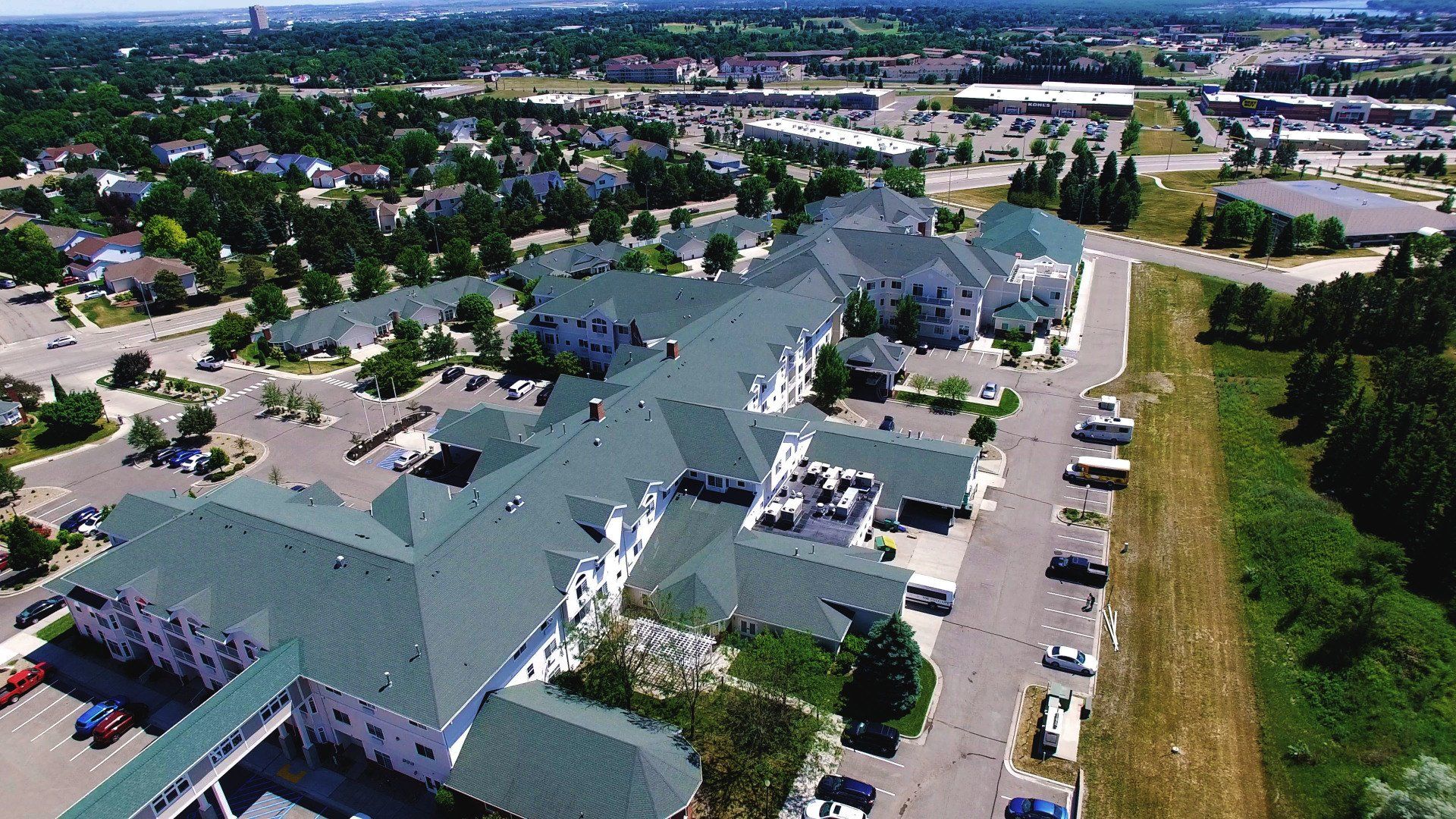 an aerial view of a large building with green roofs