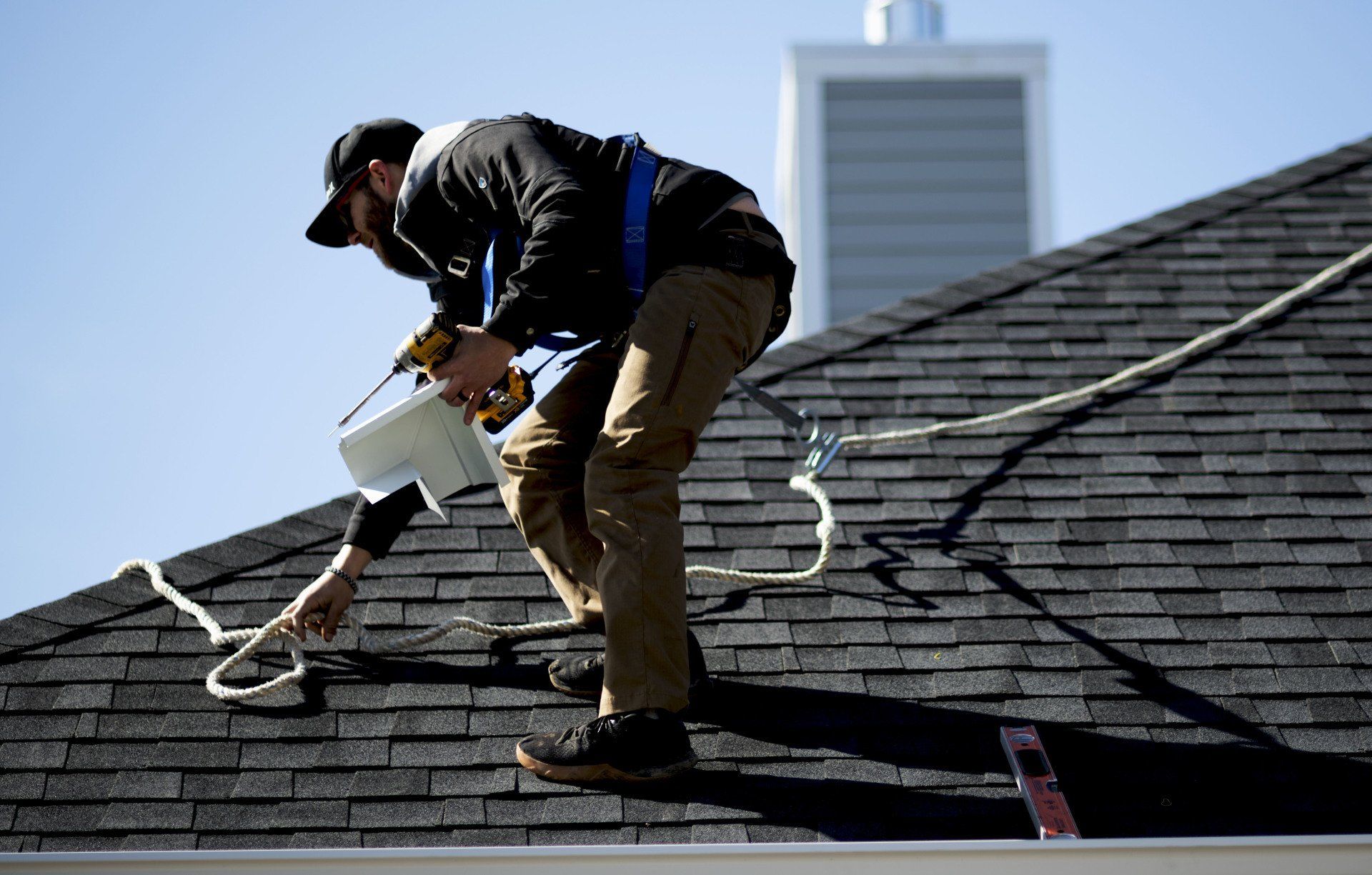 person working on roof
