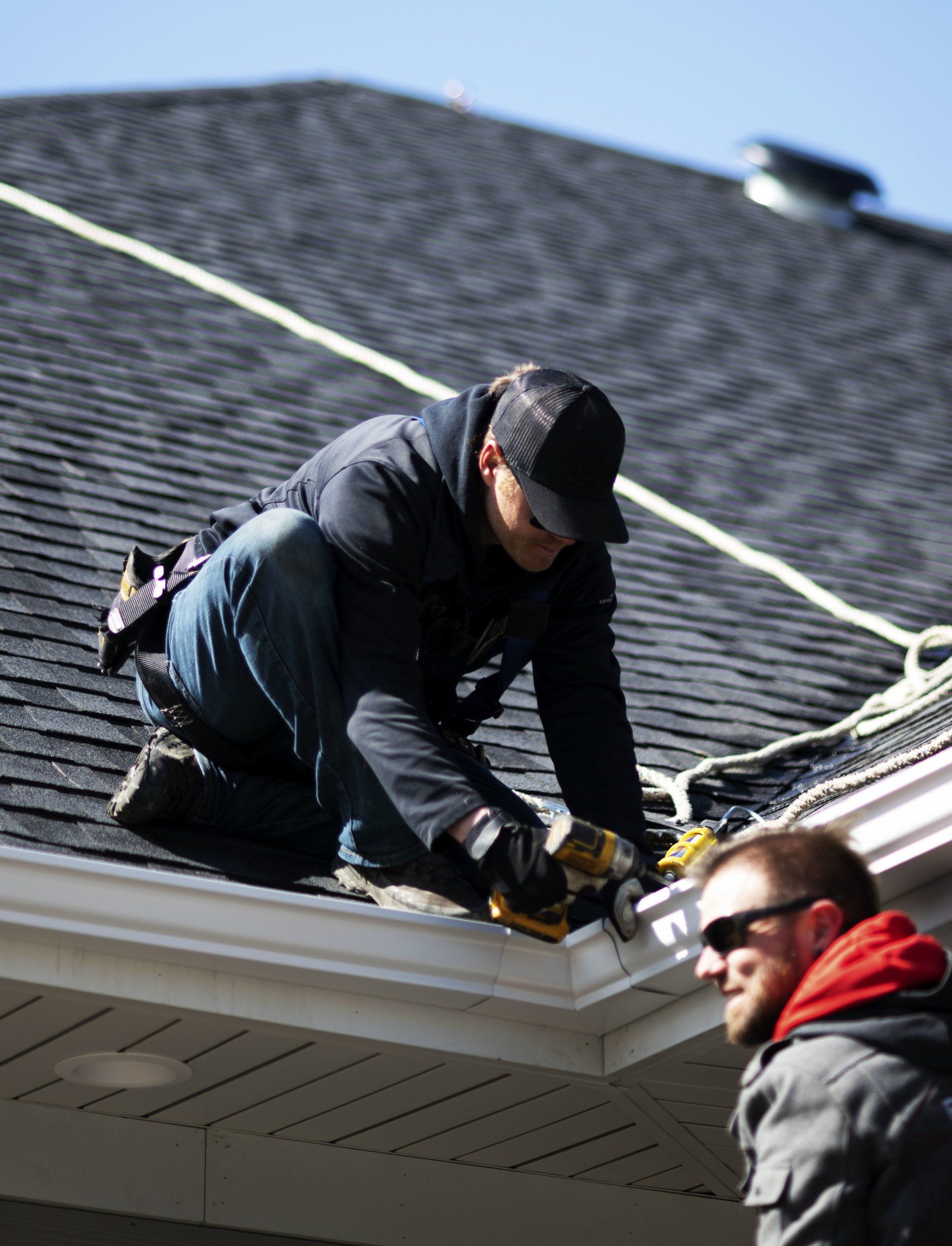 person working on roof