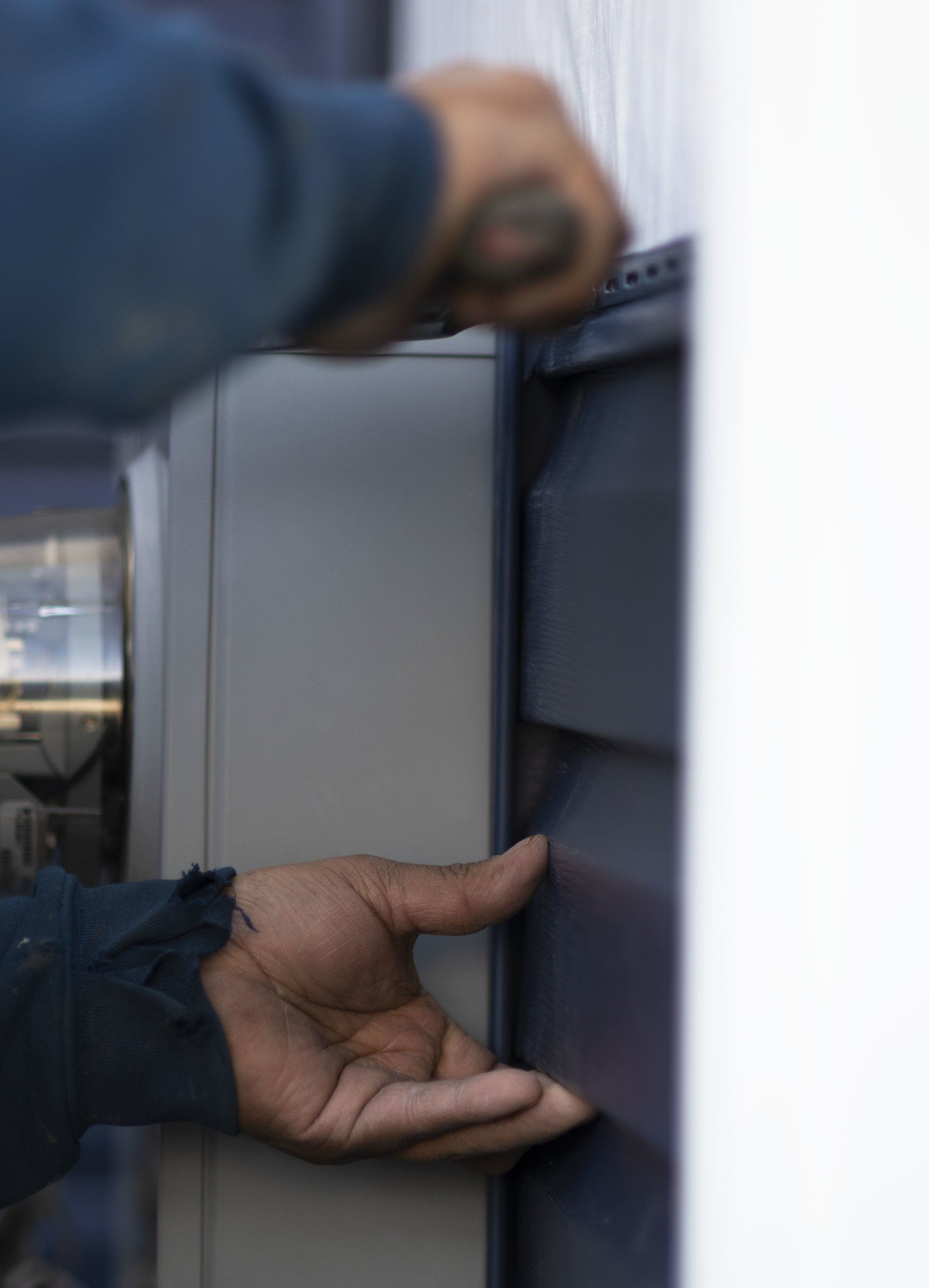 person working on siding