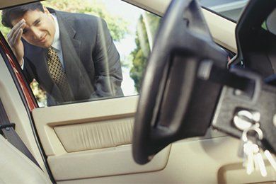 keys locked in car man looking in