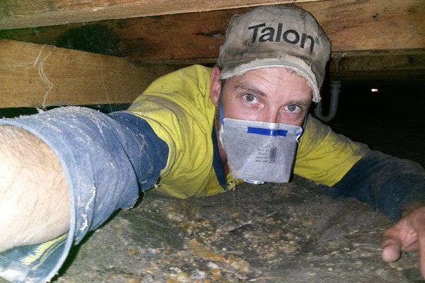 man taking selfie under house