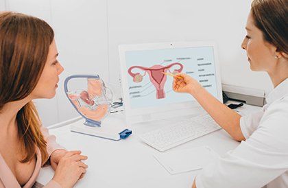 Woman Consults with Her Gynecologist — Key West, FL — Dr. Arthur J. Grizzle, M.D. A gynecology provider at an appointment in Marathon, FL