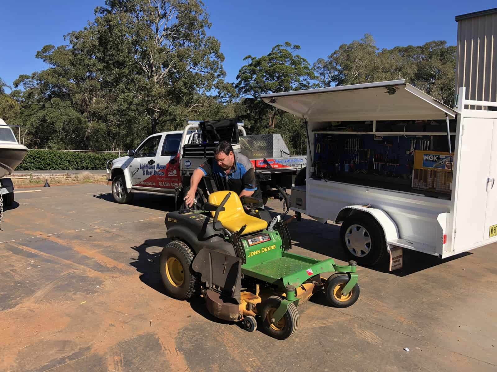 Technician Servicing Ride-On Mower