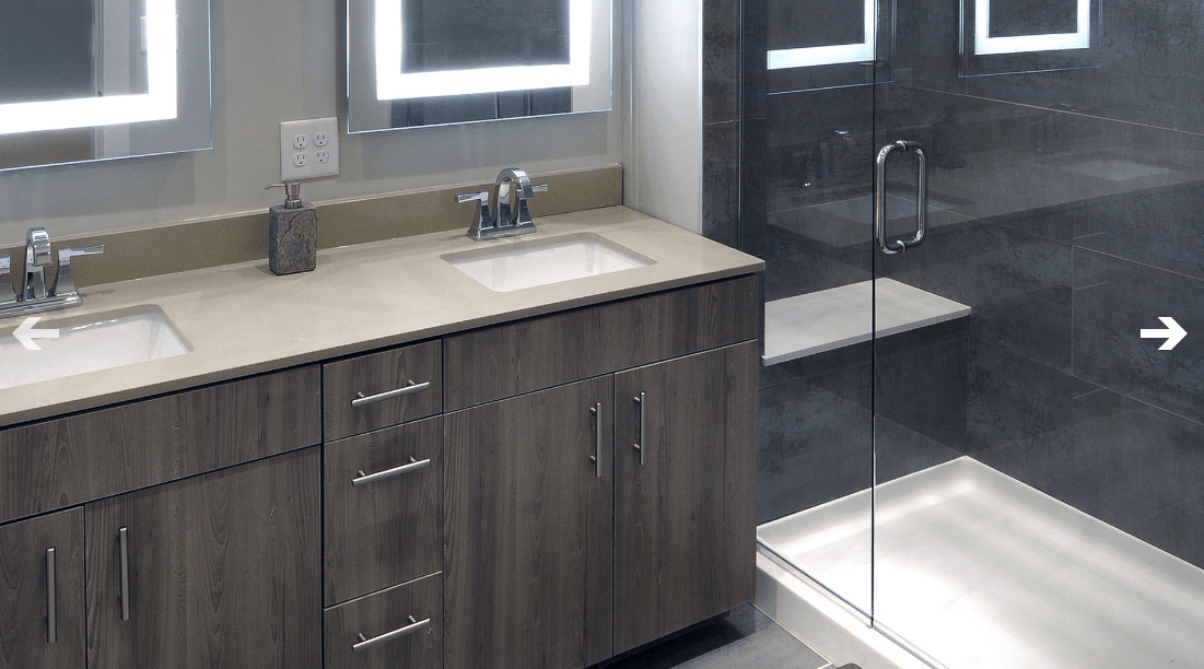 Bathroom with Frameless Shower Enclosures at North and Line