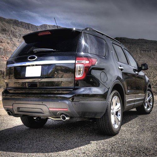 Black, shiny car in desert - American Tint & Sunroof Inc. in Spring Hill, FL Black, shiny car in desert - American Tint & Sunroof Inc. in Spring Hill, FL