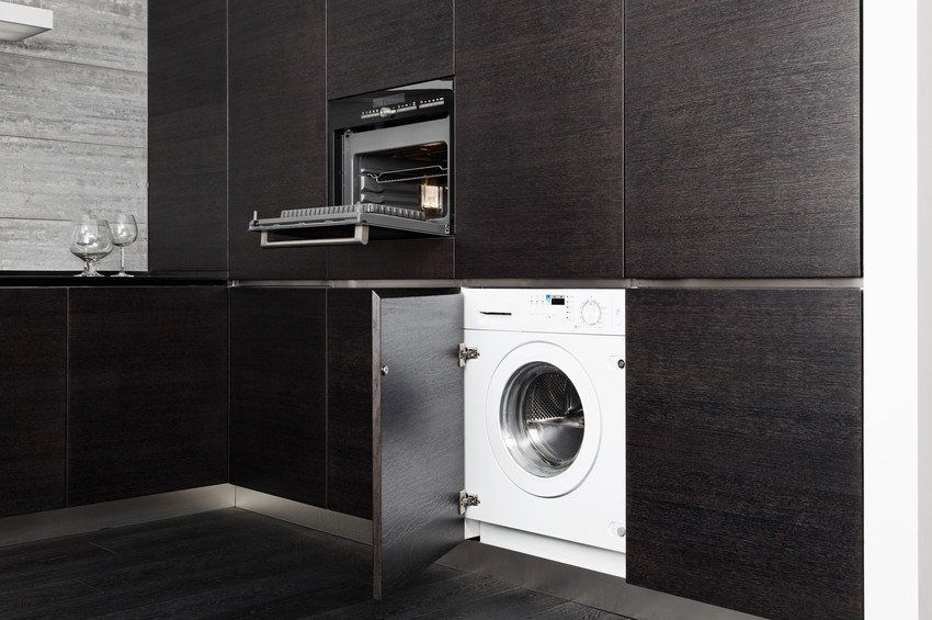 Kitchen interior fitted with washer