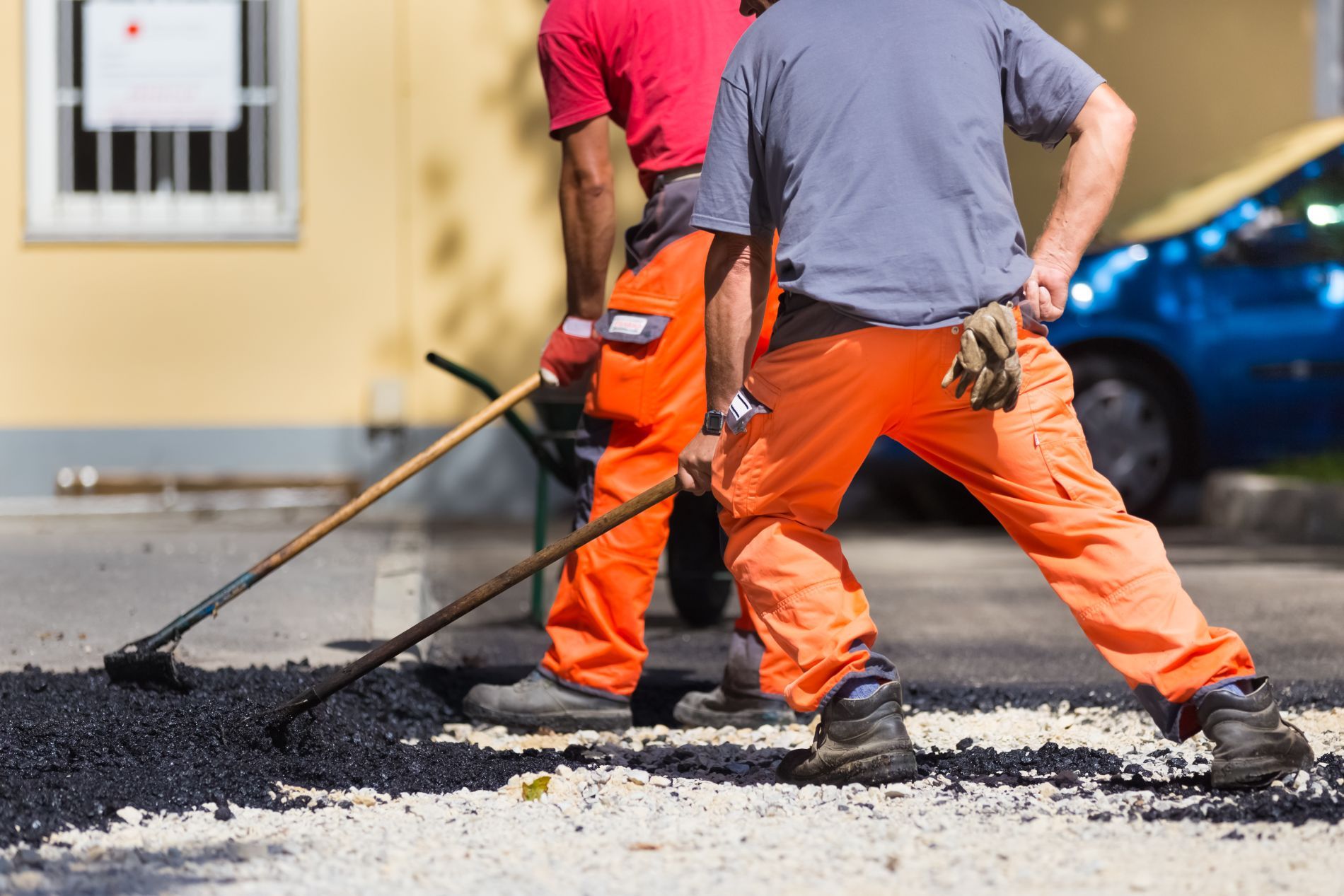 Asphalt being spread in parking lot