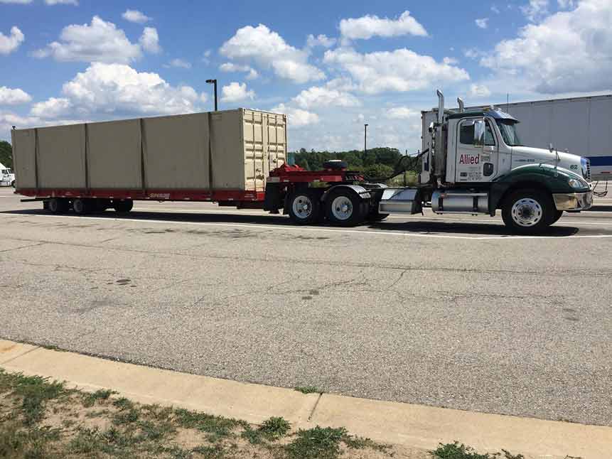 Towing Truck Services — Towing Truck Transporting Goods in Detroit, MI