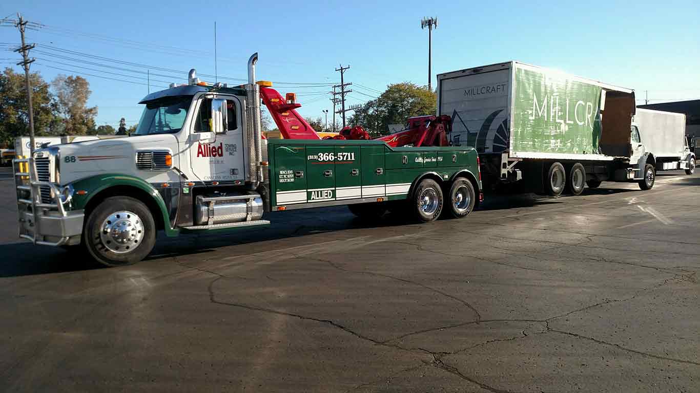 Detroit Equipment Transportation — Company Towing Truck on the Road in Detroit, MI