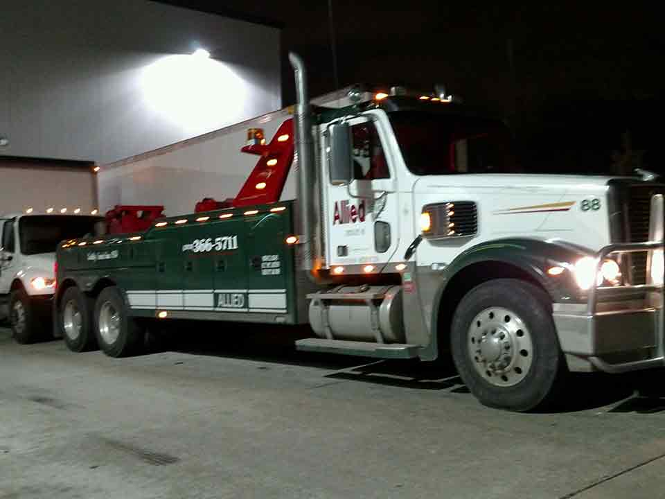 Contact Tow Truck — Towing a White Car in Detroit, MI