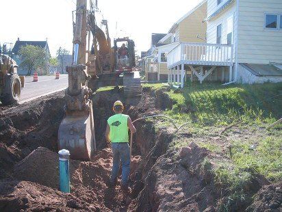 Commercial Excavation — Sidewalk Excavation in Marquette, MI Commercial Excavation — Sidewalk Excavation in Marquette, MI