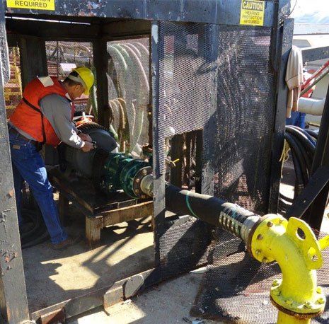 Man Checking the Water Pump Machine — Gretna, LA — Advanced Industrial Products Man Checking the Water Pump Machine — Gretna, LA — Advanced Industrial Products