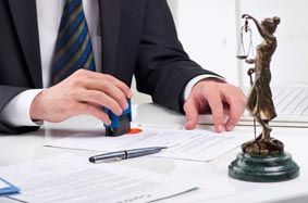 Lawyer Stamping Documents — Criminal Defense Attorneys in Park Ridge, IL Lawyer Stamping Documents — Criminal Defense Attorneys in Park Ridge, IL