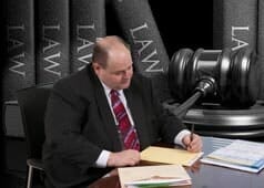 Attorney Kenneth M. Alpert Signing a Document — Criminal Defense Attorneys in Park Ridge, IL Attorney Kenneth M. Alpert Signing a Document — Criminal Defense Attorneys in Park Ridge, IL