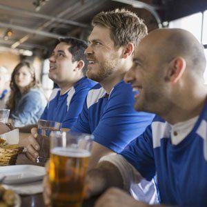 a group of happy friends enjoying their beer