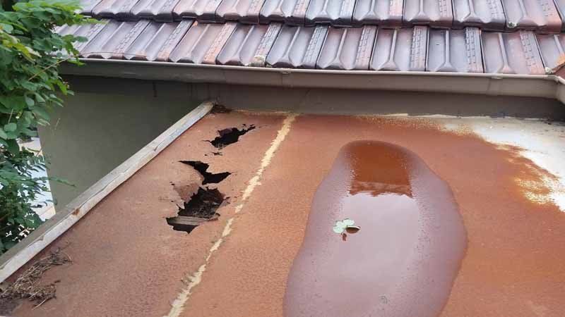 damaged roof with holes in it