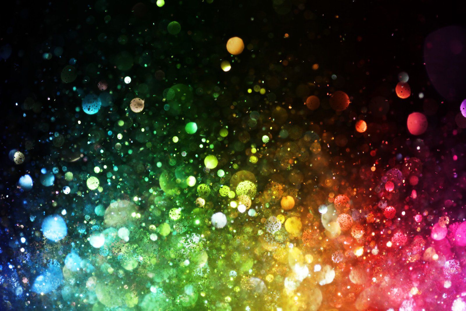 Colorful bokeh lights and sparkles on a dark background
