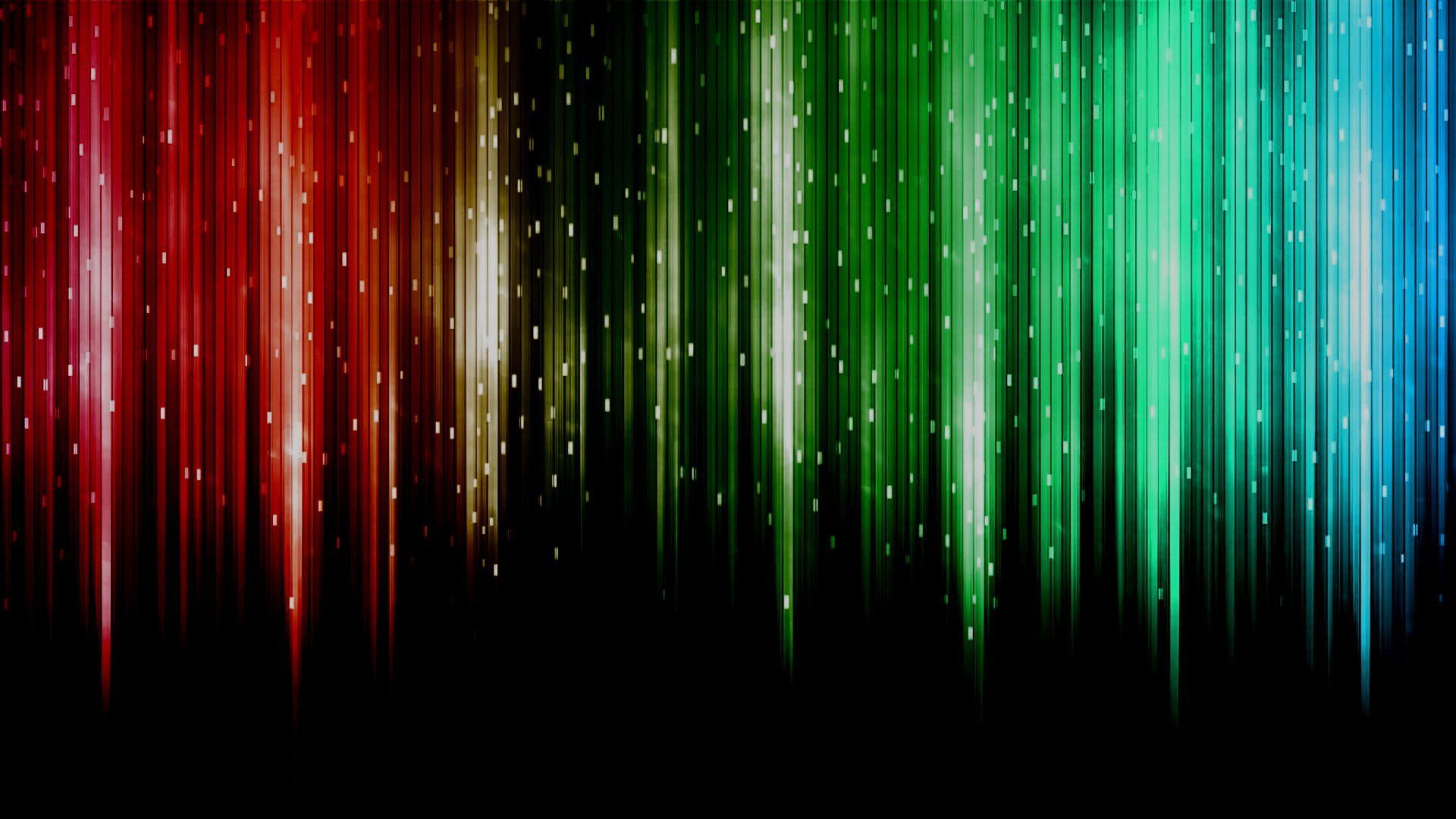 Abstract vertical light streaks in red, yellow, green, and blue on a black background