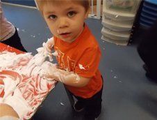 baby playing with foam
