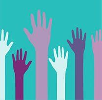 A group of people are raising their hands in the air.