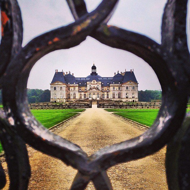 A view of a Chateau du Milandes castle through a fence