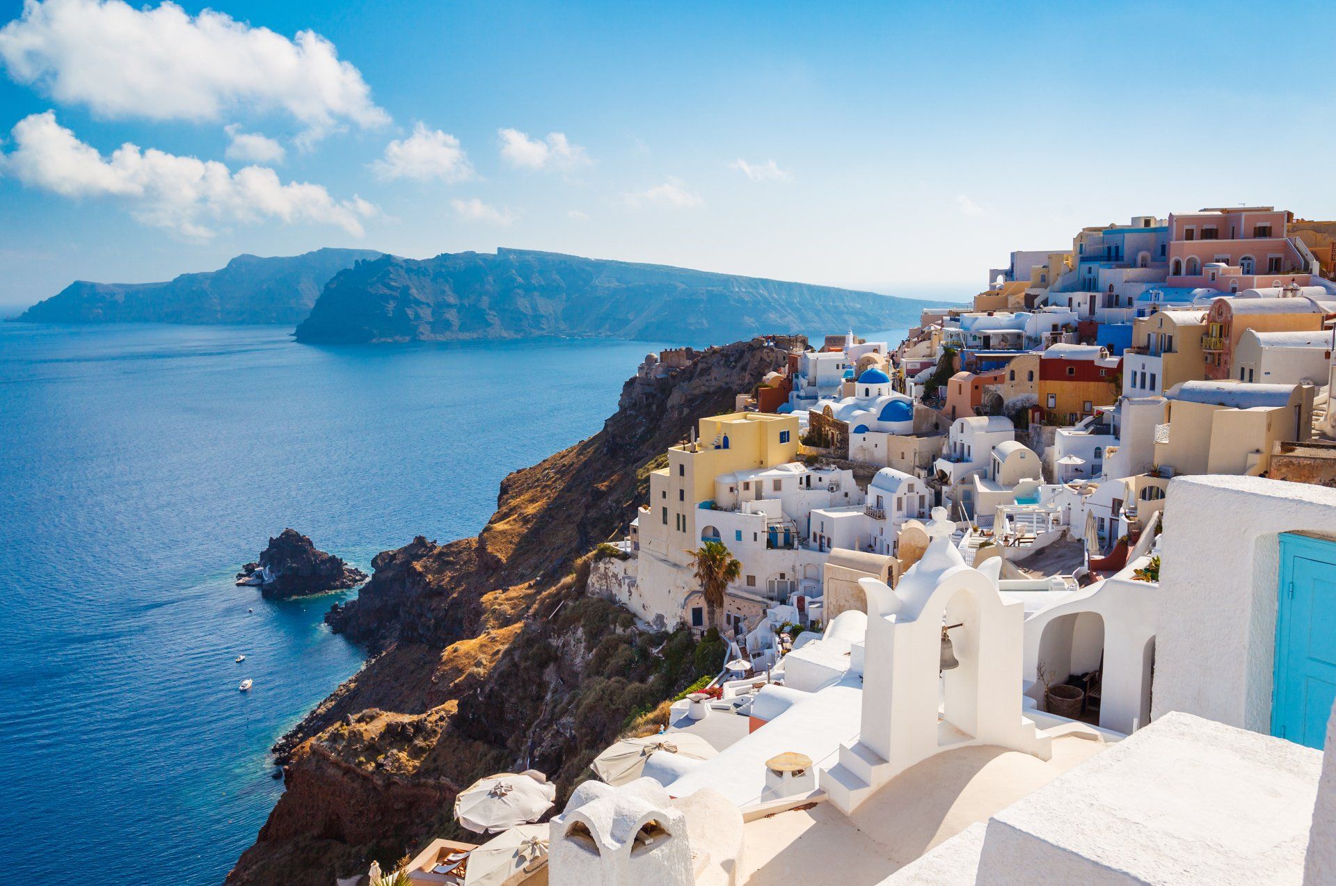 A small town on a cliff overlooking the ocean.