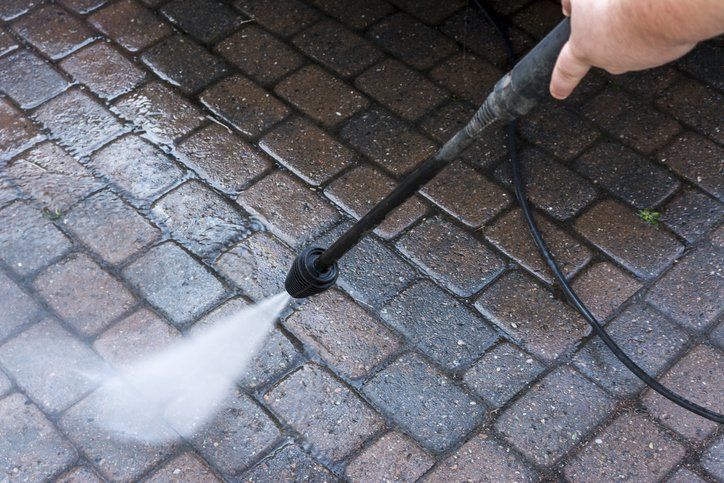 Man Washing Concrete Surface — Vancouver, WA — 3 Brothers Pressure Washing LLC
