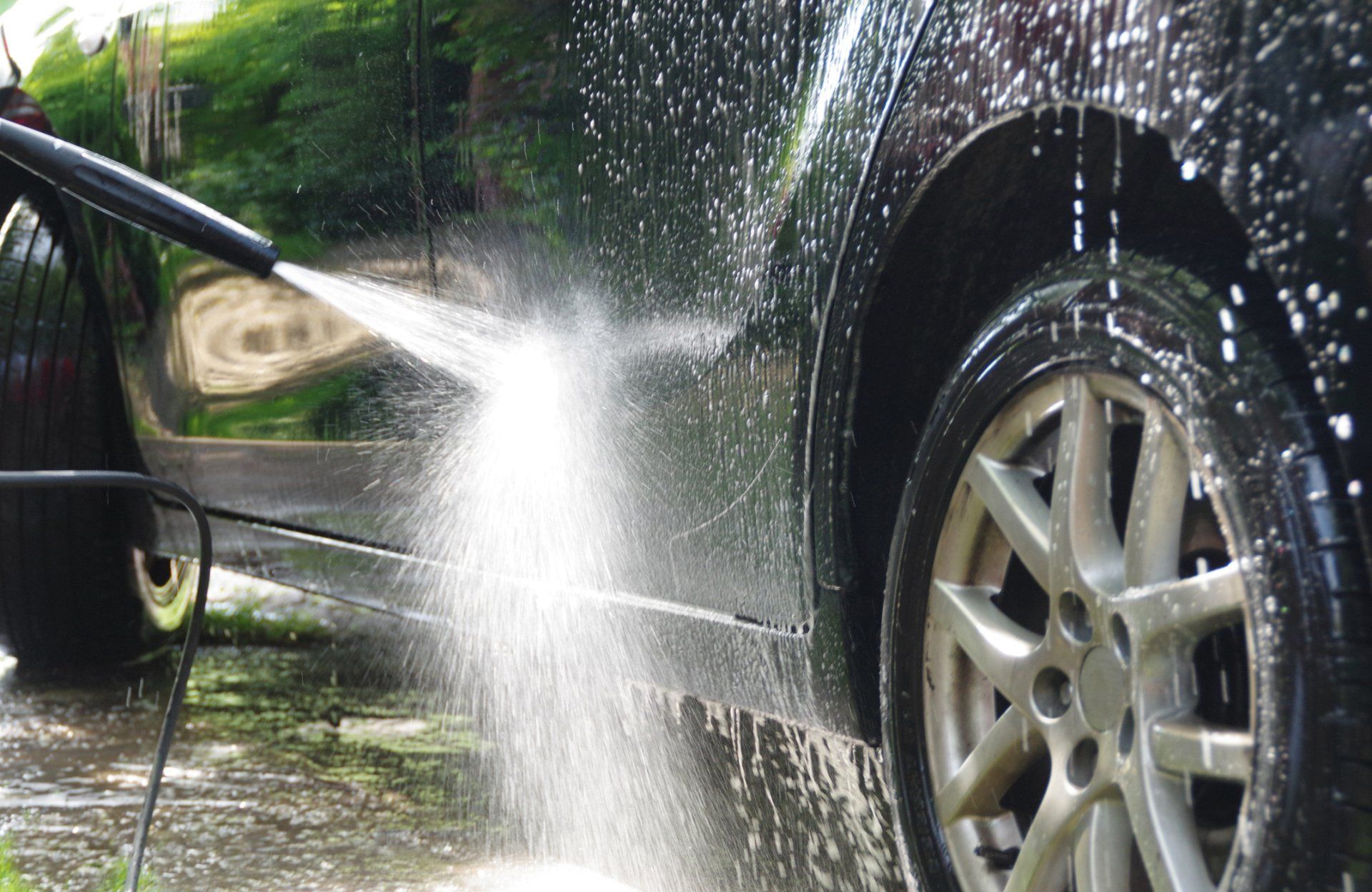 Man Washing A Black Car — Vancouver, WA — 3 Brothers Pressure Washing LLC