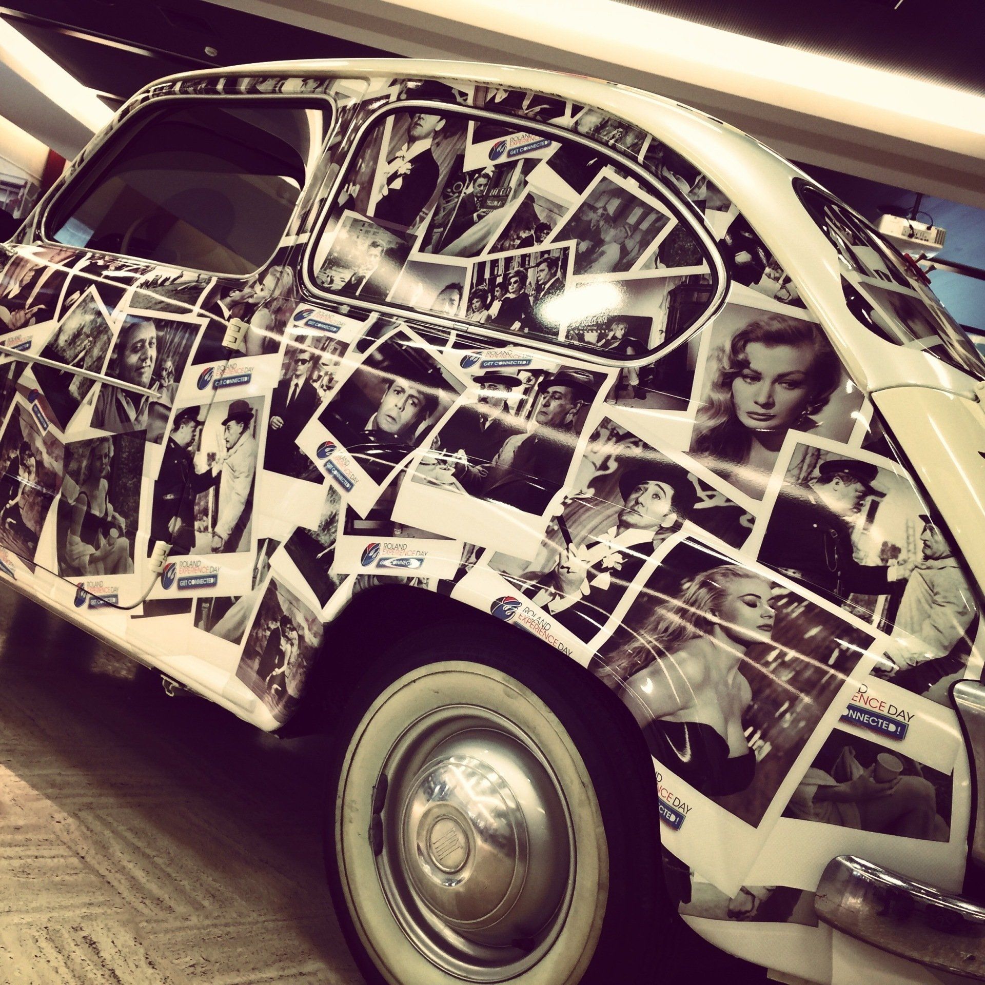 Car covered in black and white photographs of vintage Hollywood stars.