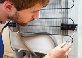 Man During Fridge Repair - Appliance Repair in Newbury Park, CA