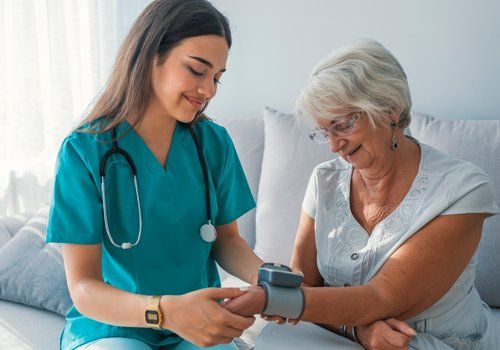Woman Measuring Blood Pressure — Plano, TX — UBP Insurance Woman Measuring Blood Pressure — Plano, TX — UBP Insurance