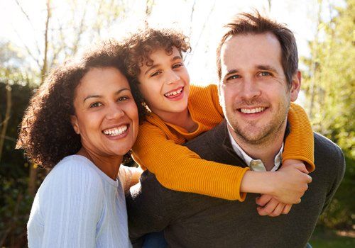 Outdoor Portrait of Smiling Family — Plano, TX — UBP Insurance Outdoor Portrait of Smiling Family — Plano, TX — UBP Insurance