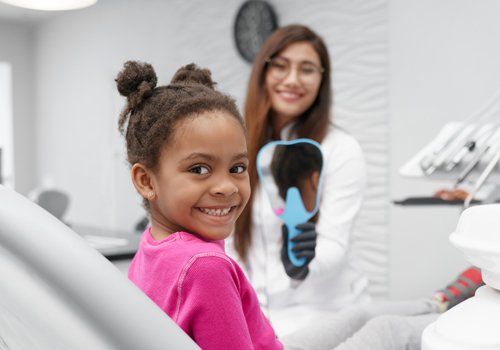 Girl Sitting on Dentist Chair — Plano, TX — UBP Insurance Girl Sitting on Dentist Chair — Plano, TX — UBP Insurance