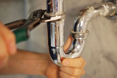 Plumber Reconstruction — Closeup of Plumber Fixing Pipe in Dallas, TX