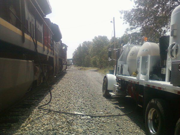 Hulcher Locomotive Service Truck providing locomotive servicing to an engine