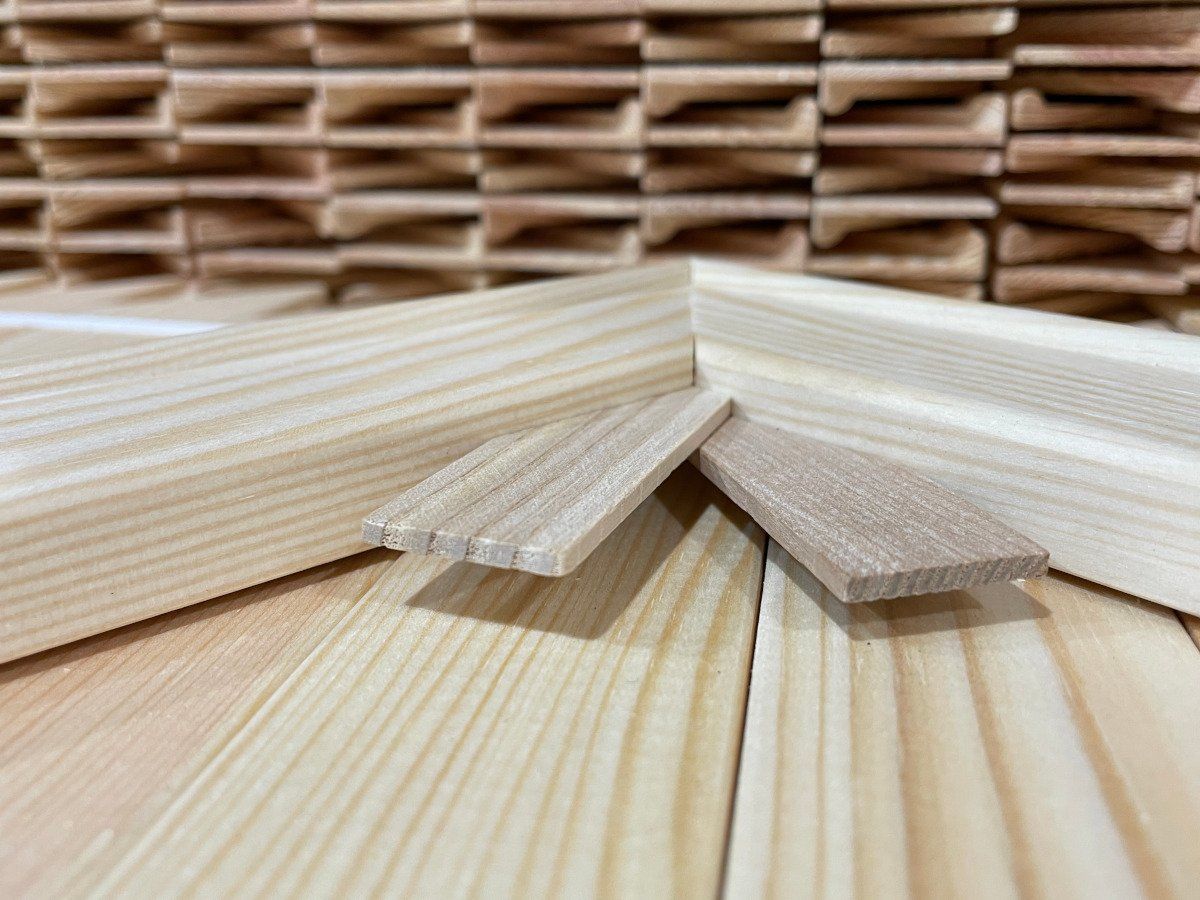 Stacked light wooden planks with a woven basket background