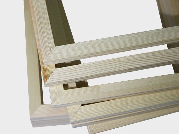 Stacked light wood picture frames with simple rectangular lines