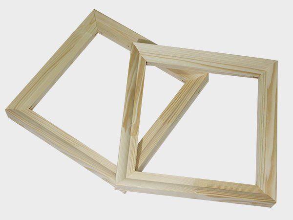 Two overlapping unfinished wooden picture frames on a white background