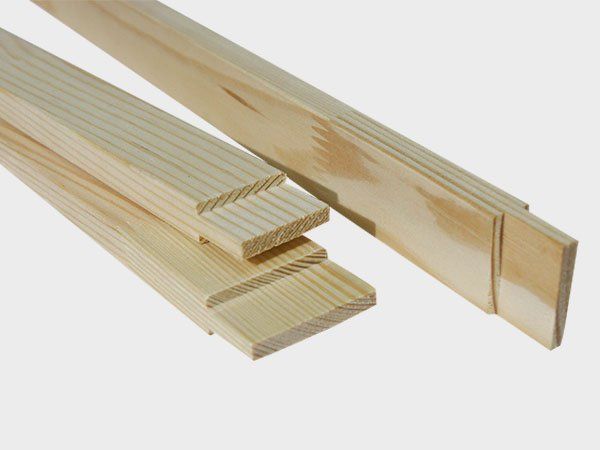 Wooden table leg joints with interlocking tenon ends on a white background