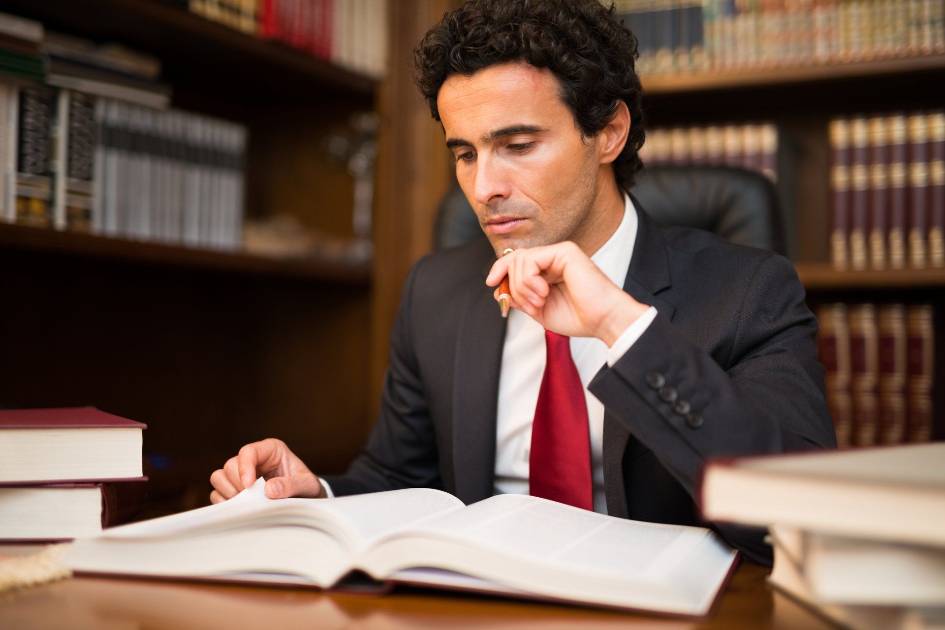 Man Reading Books — Palm Bay, FL — Roy A Alterman PA