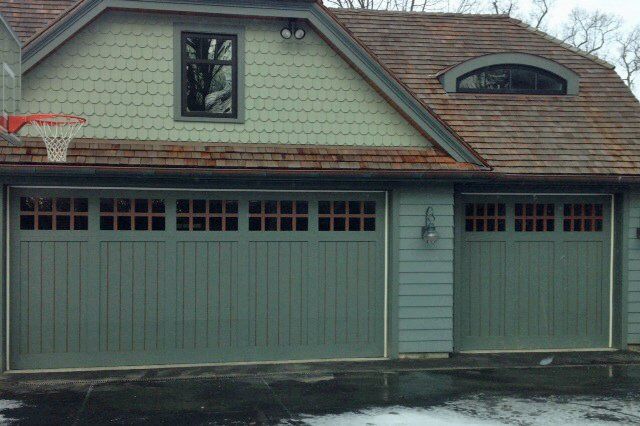 Green Garage Doors and Basketball Hoop