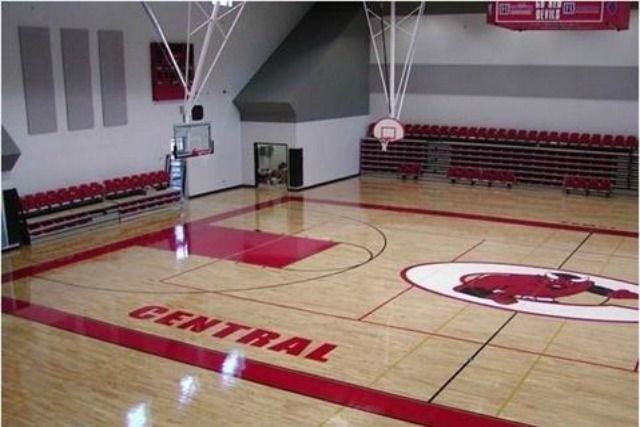 Basketball court with red and white details,