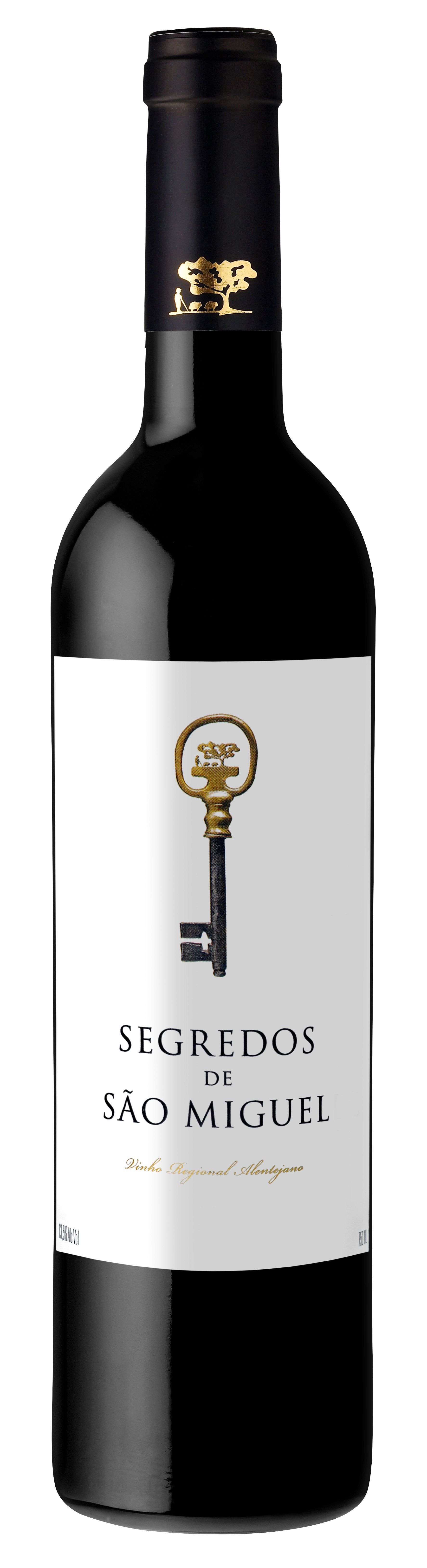 Wine bottle with a white label, gold key design, and the text