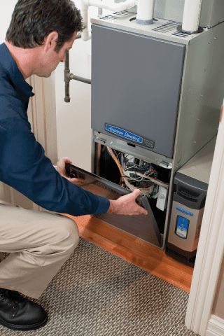 Repairman Checking Air Conditioning Unit - Heating and Air Conditioning Service in Georgetown, MA Repairman Checking Air Conditioning Unit - Heating and Air Conditioning Service in Georgetown, MA